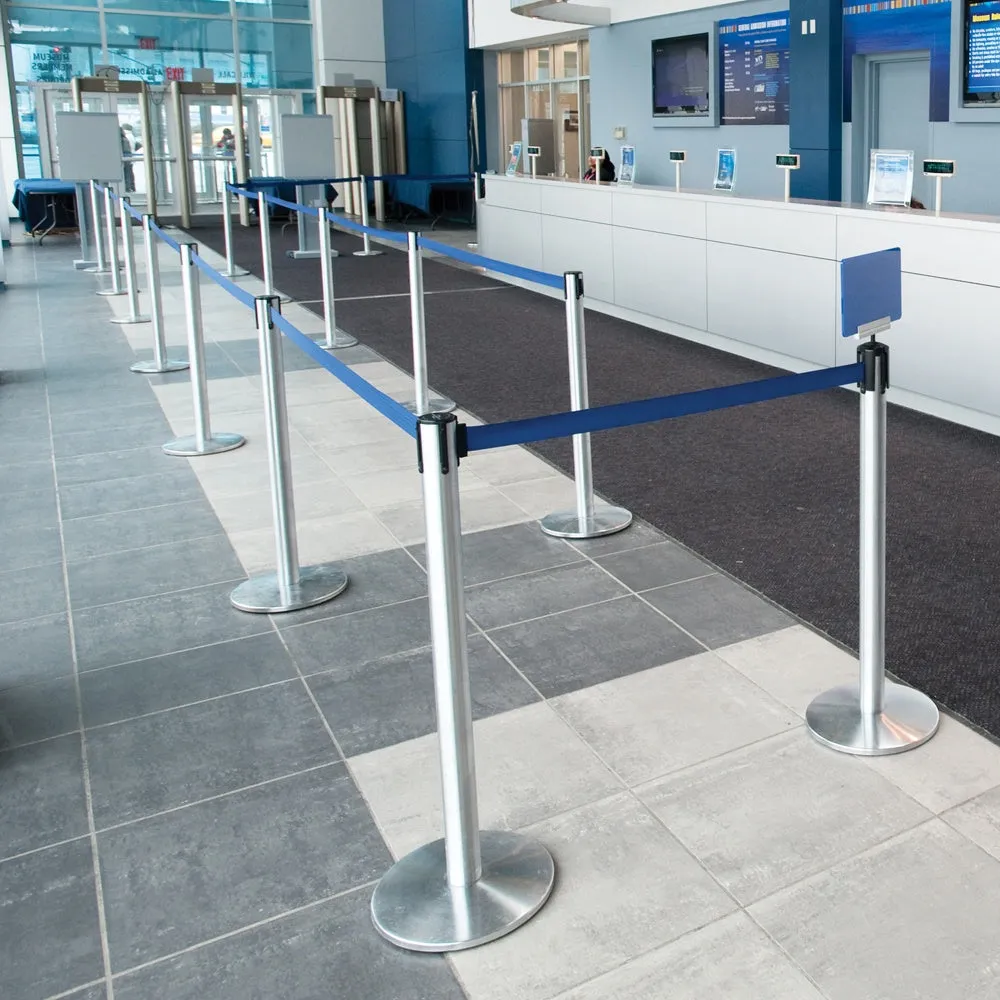 Silver belt stanchions marking a queue lane across a tiled airport floor