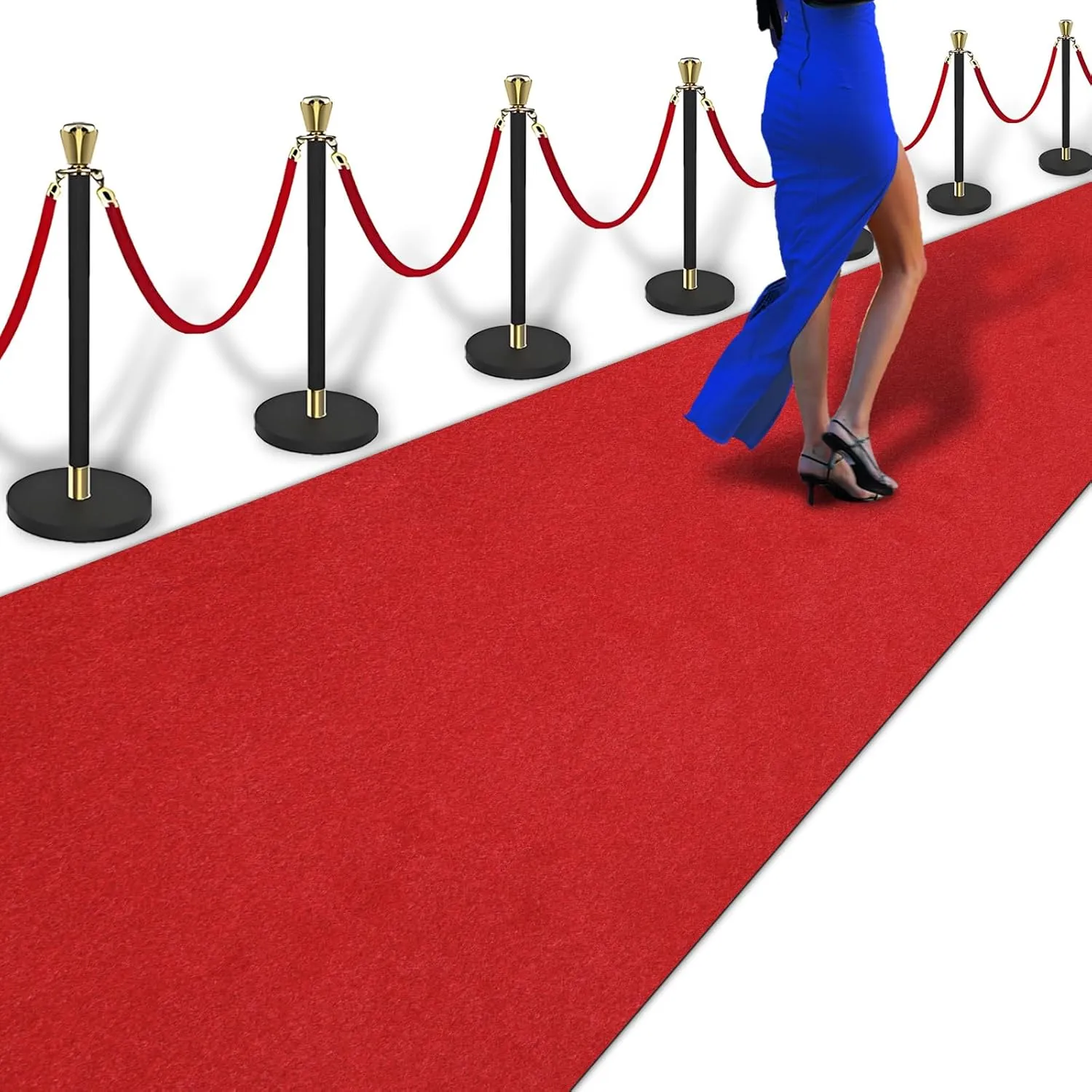 Red carpet runner laid along an entrance with stanchion posts at its edges